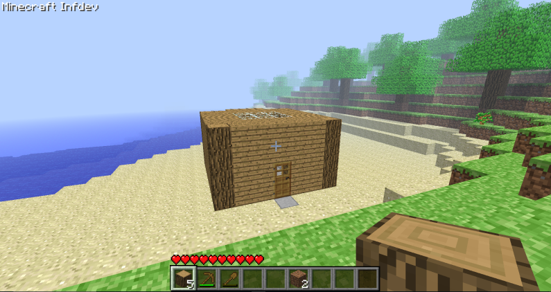 Minecraft house on a beach in indev. It has a strange back, but you can't see why. There is very thick fog.