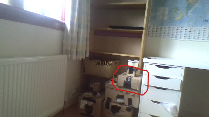 where the rats were. photo of boxes stacked with a circled small one.